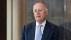 Former Lloyd’s of London boss’s relationship breached rules, firm says